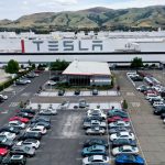 Tesla tells employees merit awards are on hold after Covid-19