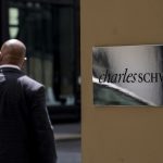 Schwab boosts staff pay by 5%, delays office return to 2022